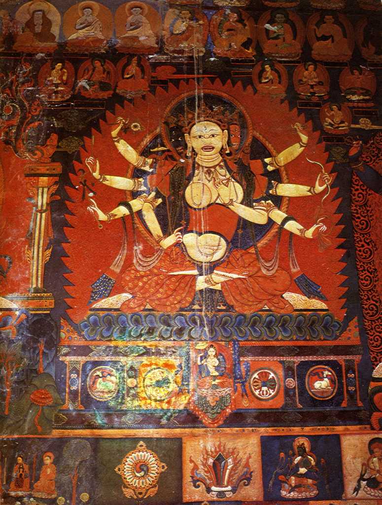 Tibet Guge 07 Tsaparang Red Temple 06 Pratisara To the right of the main door is Pratisara, with three angry faces and eight arms. She is a tantric goddess, one of the five Protectresses who are related to longevity and good deeds. In her right hands she holds the dharma wheel, an arrow, a trident-topped staff, and in her left hands she holds a vajra, a bow, and a vajra-tipped noose. Photo - Aschoff: Tsaparang - K�nigsstadt in Westtibet (1997).
